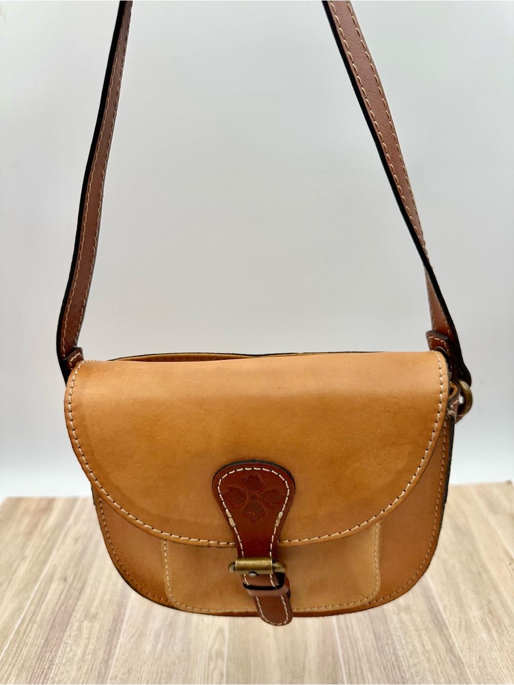 Patricia Nash Argos Camel Tan Leather Crossbody Saddle Bag Tooled Flower Accents